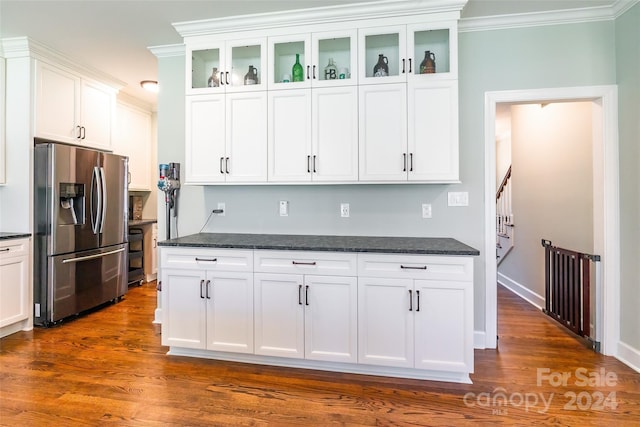 kitchen featuring white cabinets, stainless steel refrigerator with ice dispenser, dark hardwood / wood-style flooring, and crown molding