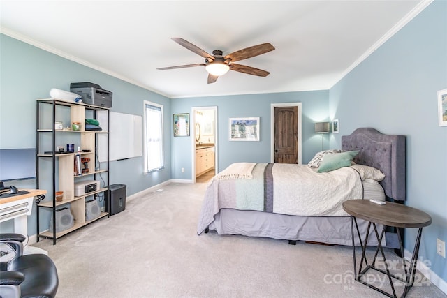 bedroom featuring ceiling fan, crown molding, light carpet, and ensuite bath