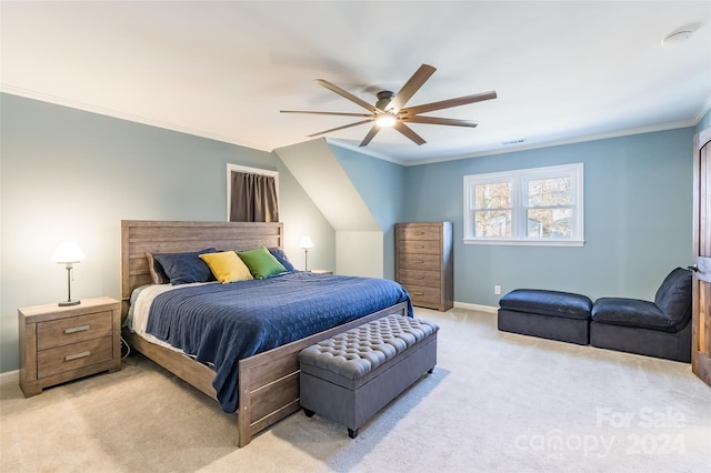 carpeted bedroom with ceiling fan and crown molding