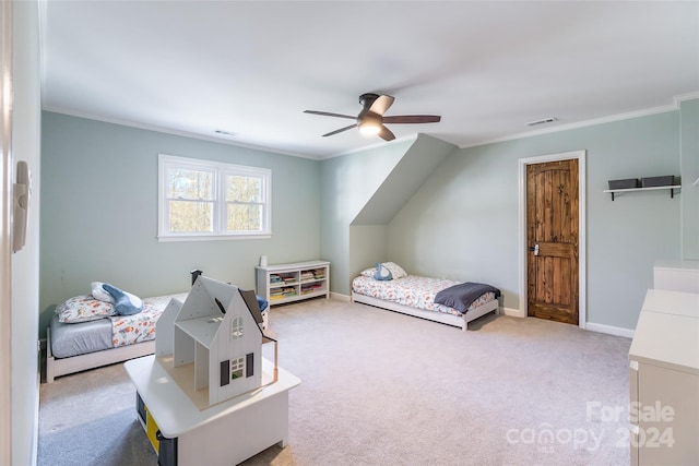 carpeted bedroom with ceiling fan and crown molding