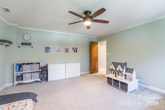 carpeted bedroom with ceiling fan and crown molding