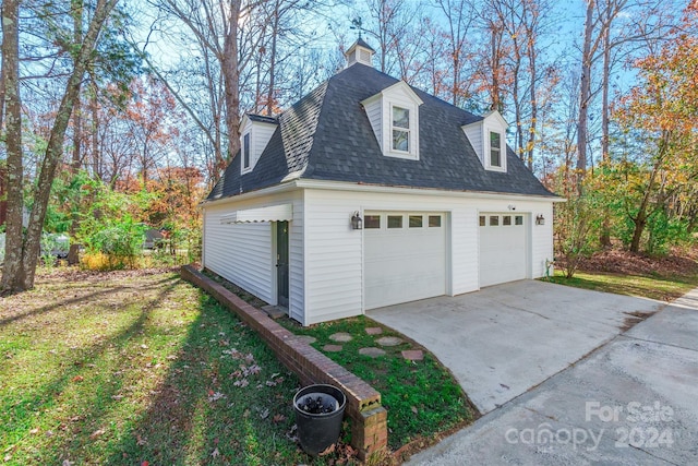 garage with a yard