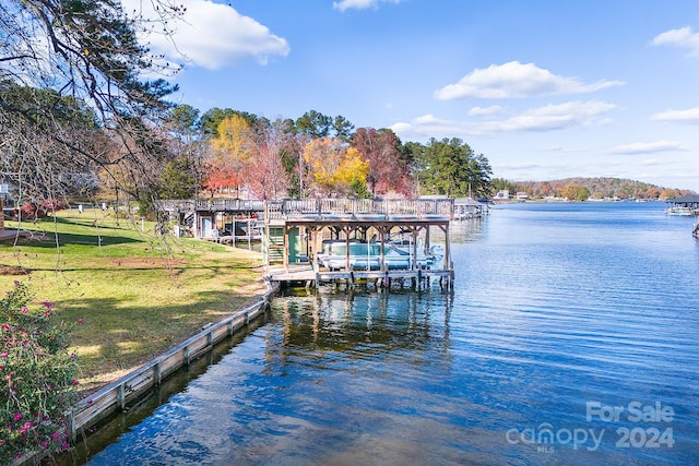 dock area featuring a yard and a water view