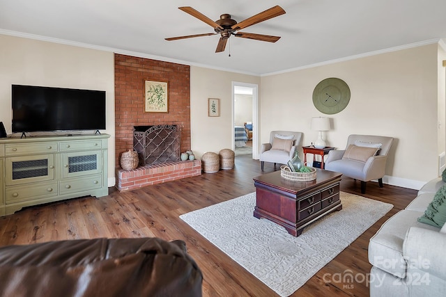 living room featuring a fireplace, ceiling fan, dark hardwood / wood-style flooring, and ornamental molding