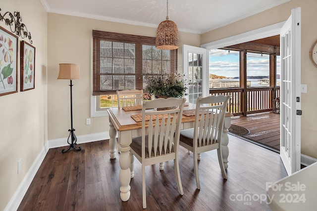 dining area featuring hardwood / wood-style floors and ornamental molding