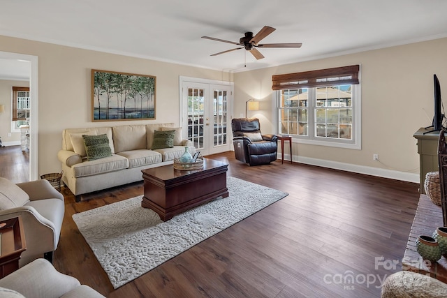 living room featuring ceiling fan, french doors, crown molding, and dark hardwood / wood-style floors