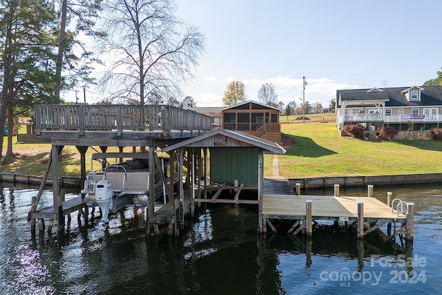 dock area featuring a yard and a water view