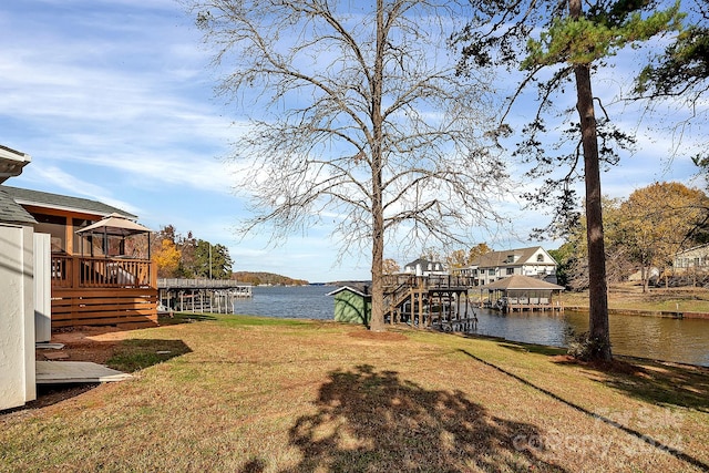 view of yard featuring a deck with water view