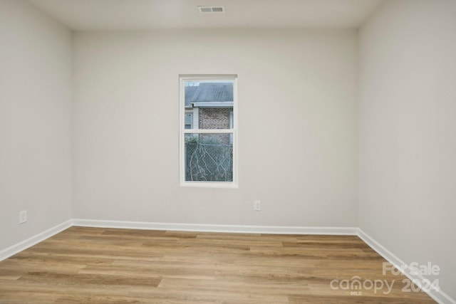 empty room featuring hardwood / wood-style flooring