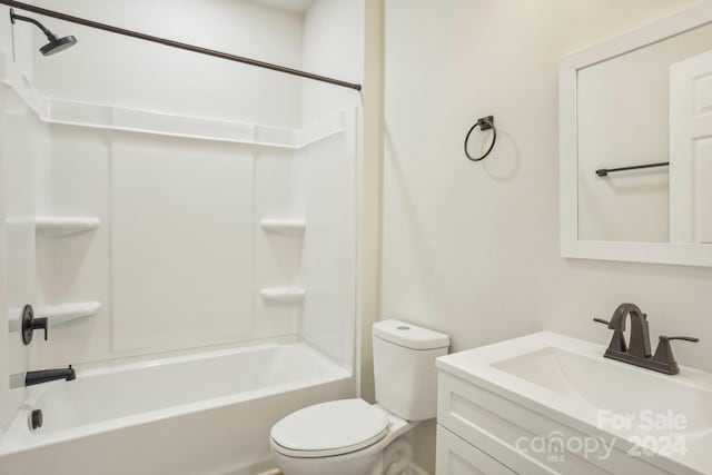 full bathroom featuring shower / washtub combination, vanity, and toilet