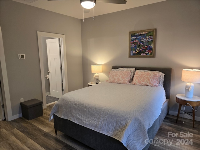 bedroom featuring ceiling fan and dark hardwood / wood-style floors