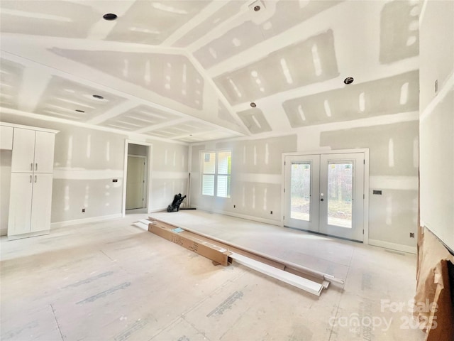 interior space featuring lofted ceiling and french doors