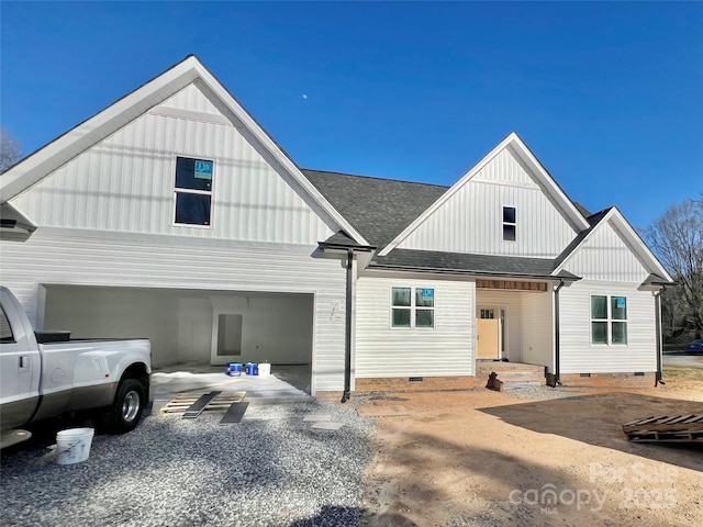 modern farmhouse style home with crawl space, board and batten siding, and roof with shingles