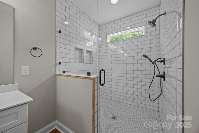 bathroom featuring vanity and a stall shower