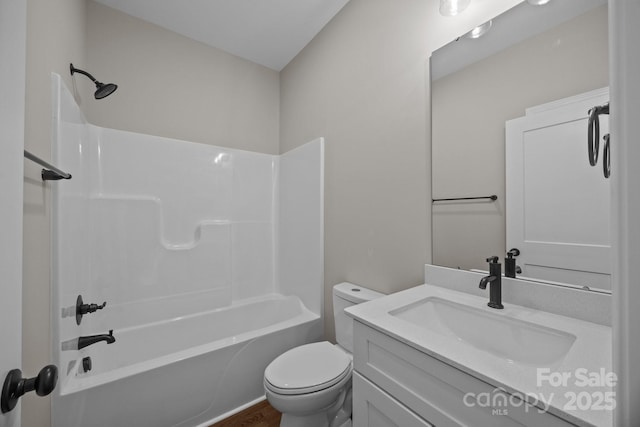 full bath with shower / bathtub combination, toilet, wood finished floors, and vanity