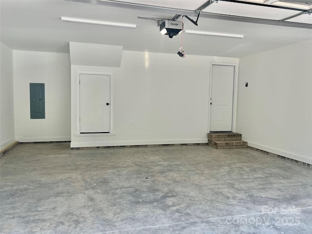 garage with baseboards, a garage door opener, and electric panel