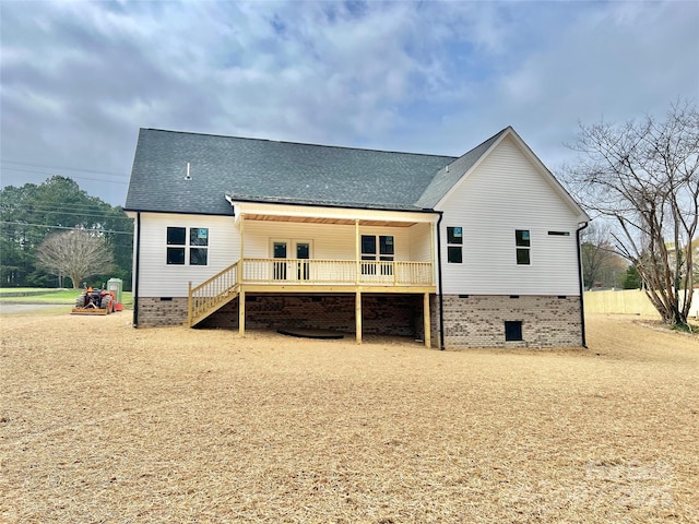 back of house featuring a wooden deck, a shingled roof, and crawl space