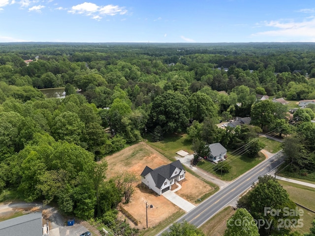 bird's eye view featuring a view of trees