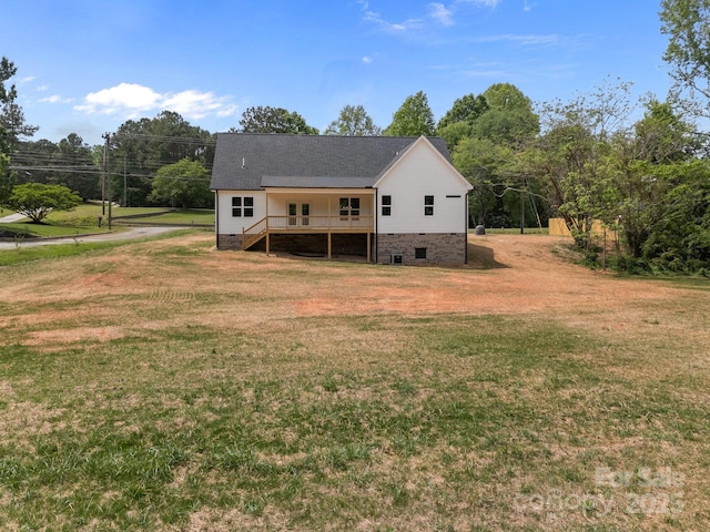 rear view of house with a lawn, crawl space, and stairs