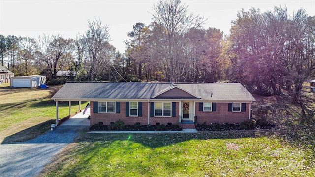 ranch-style house with a carport and a front yard