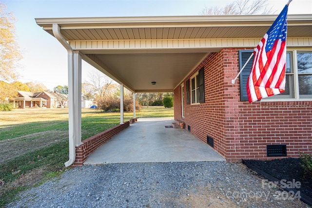 exterior space with a carport