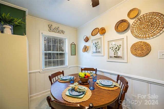 dining area featuring ornamental molding