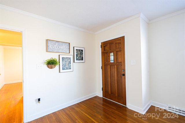 entrance foyer featuring dark hardwood / wood-style floors and ornamental molding