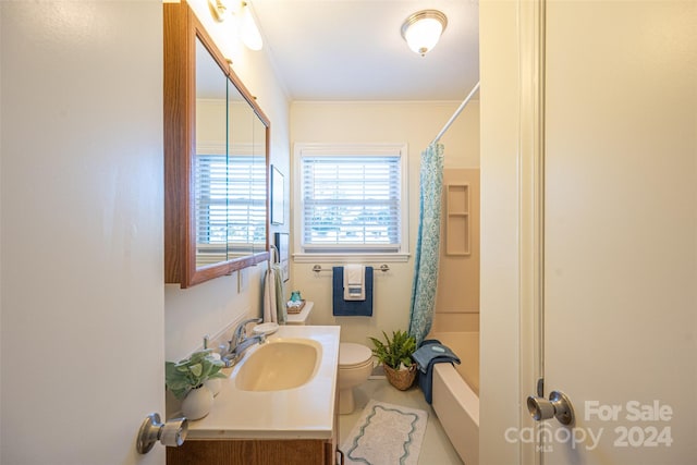 full bathroom with vanity, shower / tub combo with curtain, crown molding, tile patterned flooring, and toilet