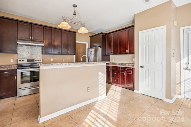 kitchen featuring stainless steel appliances, a kitchen island with sink, sink, light tile patterned floors, and hanging light fixtures