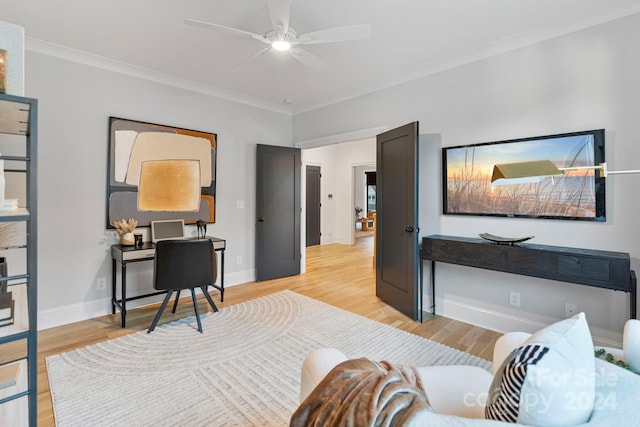 living room featuring light hardwood / wood-style floors, ceiling fan, and ornamental molding