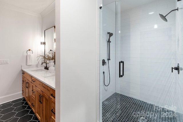 bathroom featuring tile patterned floors, vanity, an enclosed shower, and crown molding