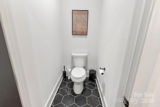 bathroom with tile patterned floors and toilet