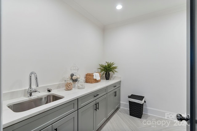 interior space with crown molding and sink