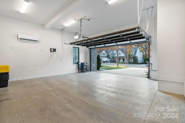 garage with a wall unit AC and a garage door opener