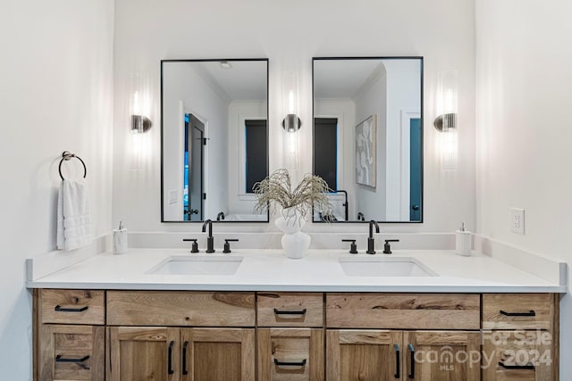 bathroom with vanity and crown molding