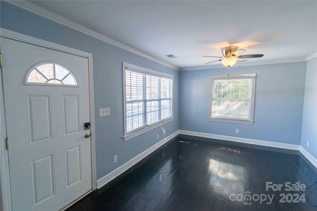 entrance foyer with ornamental molding, ceiling fan, and dark wood-type flooring