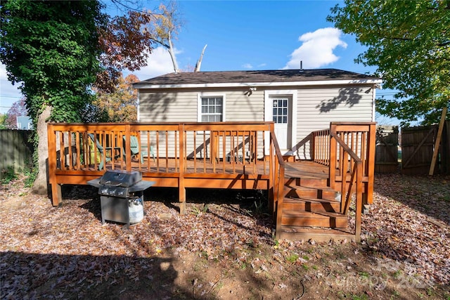 rear view of house featuring a deck