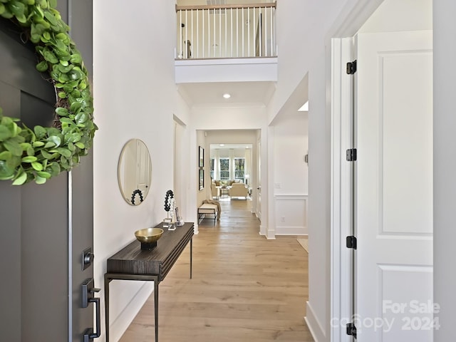 hallway with light hardwood / wood-style flooring