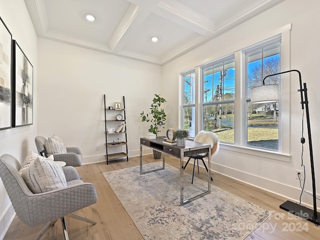 office space featuring beamed ceiling, coffered ceiling, and hardwood / wood-style flooring