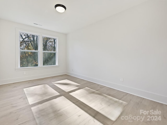 spare room featuring light wood-type flooring