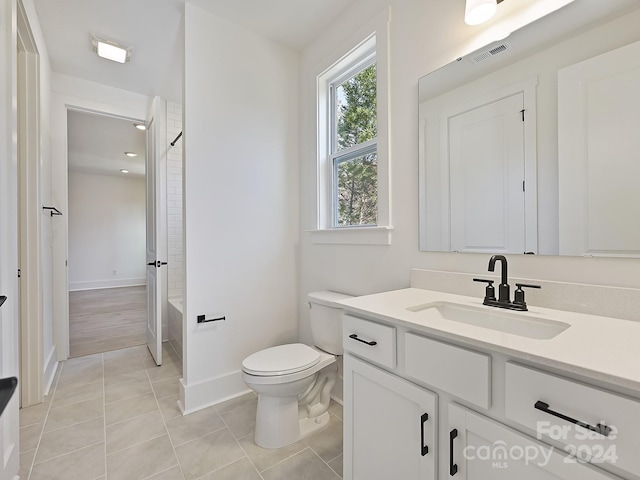 full bathroom featuring shower / bathing tub combination, tile patterned flooring, vanity, and toilet