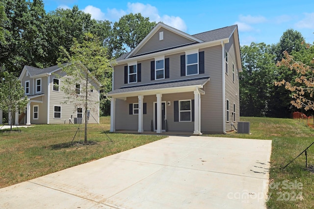 view of property featuring central AC unit, a porch, and a front lawn