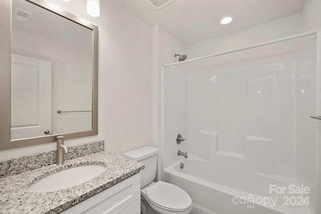 full bathroom featuring vanity,  shower combination, and toilet