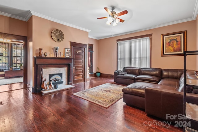 living room featuring crown molding, ceiling fan, and dark wood-type flooring