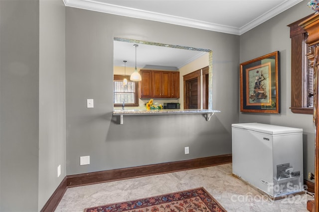 laundry room featuring crown molding