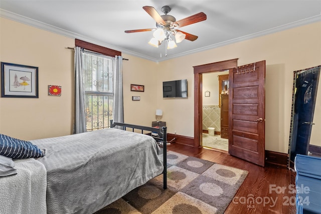 bedroom with dark hardwood / wood-style floors, ceiling fan, crown molding, and ensuite bathroom