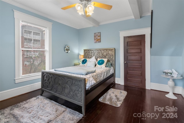 bedroom featuring beamed ceiling, dark hardwood / wood-style floors, ceiling fan, and crown molding