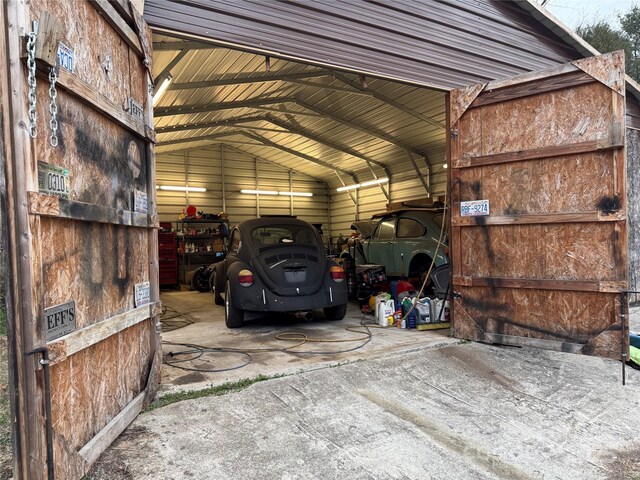 garage featuring a carport