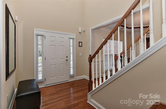 foyer with dark hardwood / wood-style floors