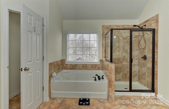 bathroom featuring tile patterned flooring, shower with separate bathtub, and vaulted ceiling